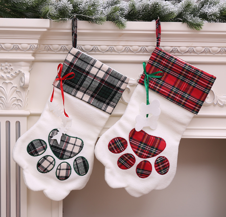 Our Dog Paw Christmas Stocking is the perfect way to celebrate the holiday season with your furry friend. With its adorable paw-print design, it will add a touch of fun and personality to your holiday décor. Made with high-quality materials, this stocking is both durable and long-lasting, ensuring that it will be a cherished part of your holiday traditions for years to come.