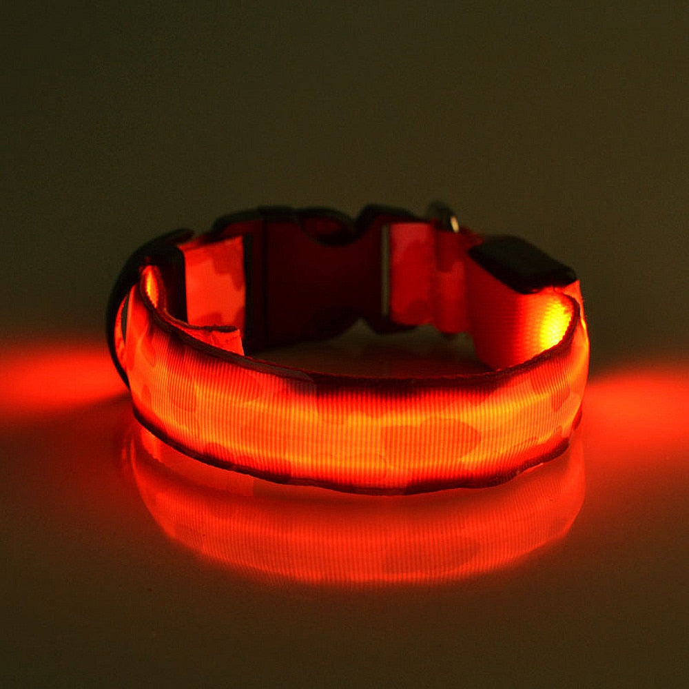 This LED Light-Up Dog Collar is equipped with lights that emit bright, colorful beams and is designed to make dogs more visible in low-light conditions and can help keep them safe while walking or playing in the dark. The dog collar is made of nylon and plastic, is sturdy, and wear-resistant. It has 3 adjustable lighting modes: constant on, fast flash, and slow flash. 